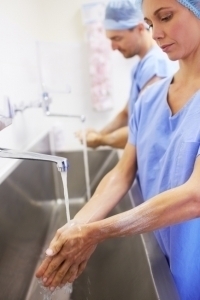 Two medical colleagues washing their hands before an operation