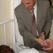 Prof. Didier Pittet with an Ebola infected african child