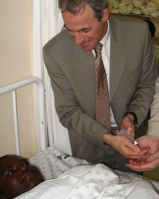 Prof. Didier Pittet with an Ebola infected african child