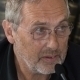 Portrait of Univ.-Prof. Dr. Norbert Pateisky speaking into a microphone