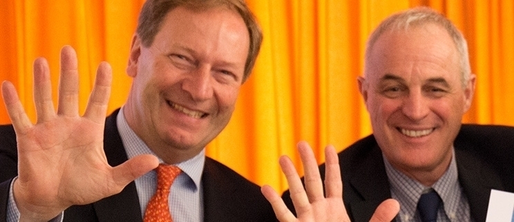 Picture of Bernhard Küenburg and Didier Pittet waving hands at the CEE Conference