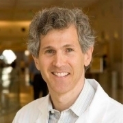 Portrait of Prof. Mark Sklansky in a white coat